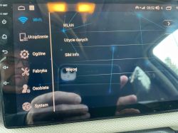 Ekran ustawień systemowych z widocznymi kategoriami jak Wi-Fi, Urządzenie, Ogólne, Fabryka, Osobiste i System.
