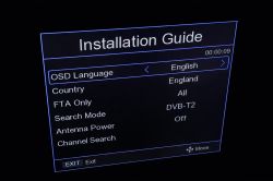 DVB-T2 set-top box installation screen with language, country and search options