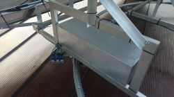 Solar Tracker Controller on Metal Structure Controller block mounted on a metal structure of a solar tracker with visible cables.