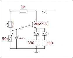 Schemat prostego układu elektronicznego z użyciem tranzystora 2N2222 i fotorezystora.