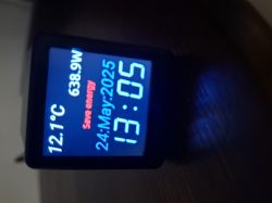 Electronic display showing temperature, power, date, time, and a red Save energy message.