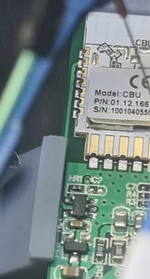 Close-up of an electronic circuit with a visible module and markings on the circuit board.