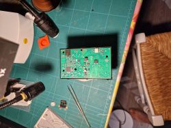 Printed circuit board with electronic components on a green cutting mat