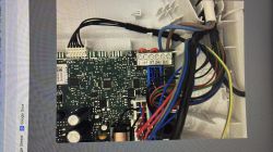 Close-up of thermostat circuit board with B.off, RT, 24V, and BUS terminals