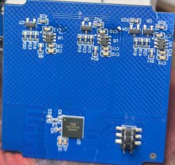 Blue PCB with surface-mounted components and integrated circuits