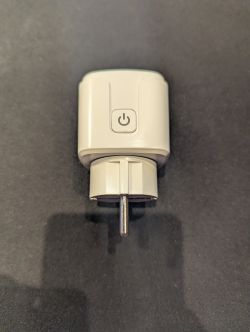 Smart Electric Socket with Button Smart electric socket in gray with a visible power button.