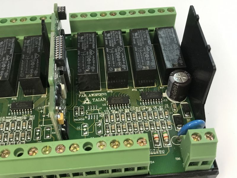 The interior of an old Schneider Electric SR1 A201BD programmable logic controller