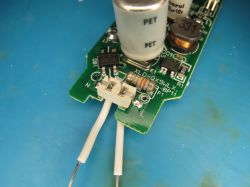 Electronic components on a PCB Close-up of PCB with capacitors, resistor, and MB10F bridge rectifier