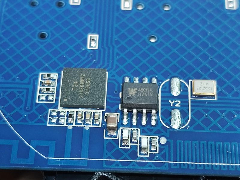 Close-Up of T34 Integrated Circuit on PCB Close-up of a PCB with T34 integrated circuit and several other components.
