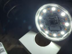 Round circuit board with LEDs emitting bright light.