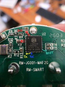 Close-up of a PCB with LN882HK IC and color pin labels: 3V3, TX, RX, BOOT, GND