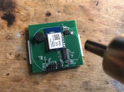 TYWE3S Module with Hot-Air Soldering Tool TYWE3S module on a circuit board next to a hot-air tool.