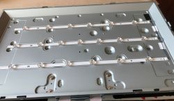 Panel with three LED strips mounted inside a monitor or TV housing