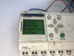 The interior of an old Schneider Electric SR1 A201BD programmable logic controller