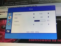 Monitor OSD menu showing input, mute, volume and FreeSync options