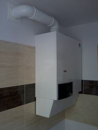 Jaki piec dwufunkcyjny do domu 97m² z grzejnikami Purmo i kominem fi 125mm?