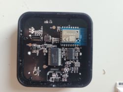Printed circuit board inside an electronic device with components such as chips and resistors.