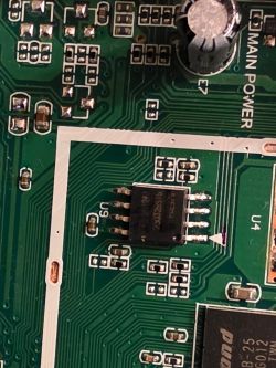 Close-up of U9 integrated circuit on green PCB with visible traces and components.