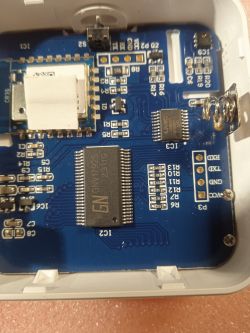 Close-up of the interior of an electronic device showing a PCB with electronic components.