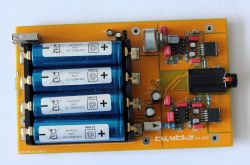 Printed circuit board with a headphone amplifier circuit and four 18650 batteries.