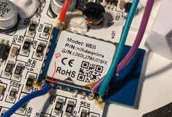 Close-up of a circuit board with wires connected to a module labeled as Model: WB3S.