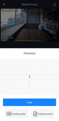 Screenshot of a mobile app showing a camera view and pet feeding options.