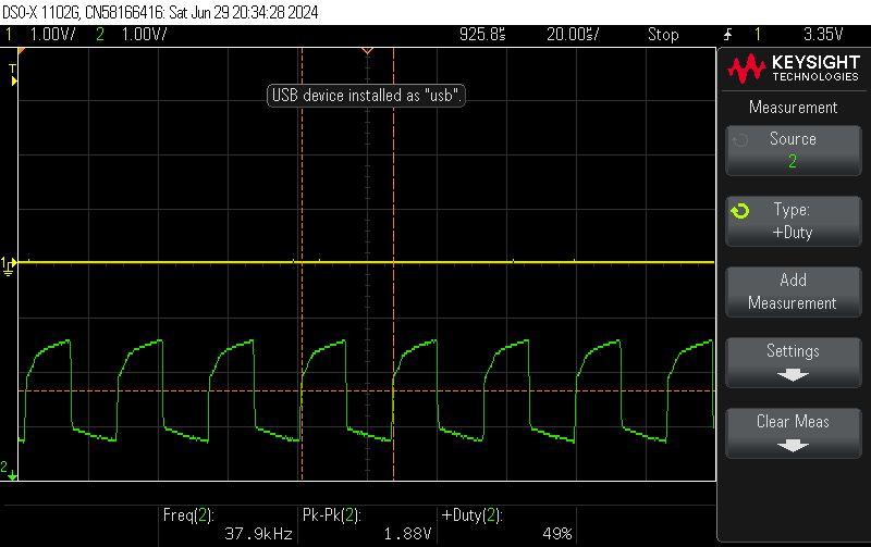 IR Signal Analysis on Oscilloscope Oscilloscope screen displaying a modulated IR signal