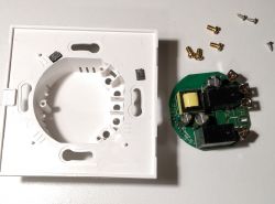 Disassembled TEEPAO WI-FI Curtain Switch Open casing with power board and screws on a white background.