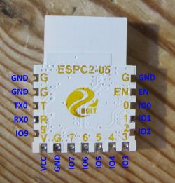 Image of an ESPC2-05 module with pin labels on a wooden surface.
