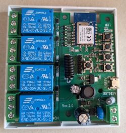 Circuit board with four blue relays and electronic components.
