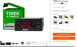 Elektroniczny licznik z wyświetlaczem obok opakowania z napisem TIMER 6 FUNKCJI.