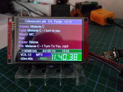 Color TFT screen on a board shows MP3 playback details and a large time display reading 11:40:38.