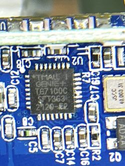 Close-up of a TG7100C Chip on an Electronic Module Close-up of an electronic module with a chip labeled TG7100C.