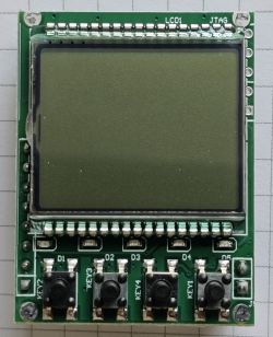 Electronic module with LCD screen and five labeled push buttons