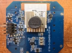 Close-up of a circuit board with a Wi-Fi module labeled AXYU.