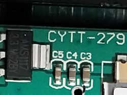 Close-up of a circuit board showing the CYTT-279 and AMS1117 chip markings on a green PCB.