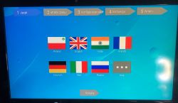 Ekran wyboru języka na Smart TV Android Box z wybranym językiem polskim.