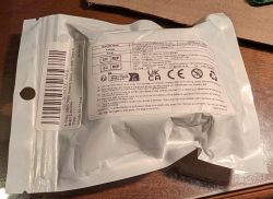 Packaging with Nintendo Switch accessory label and safety information