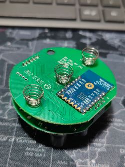 PCB of Etersky WF-CS01 Device PCB with a chip and three spring contacts.