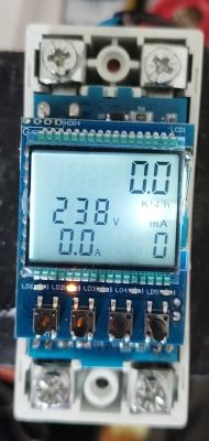 View of an electric energy meter with a backlit display showing various values.