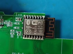 WiFi and Bluetooth communication module XT-BL12 on a green PCB