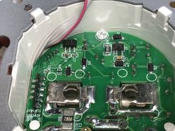 Inside the SWP86-01OG Smart Socket – PCB and Components Interior of an electrical socket showing PCB, wires, and electronic components.