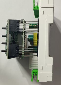 Electronic module with PCBs and electrolytic capacitors Side view of electronic module with PCBs, capacitors and pin connectors
