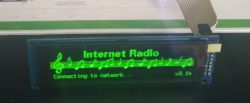 OLED screen displaying Internet Radio with green text Connecting to network and musical notes.