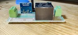 ESP8285 module on a prototype board with a relay.