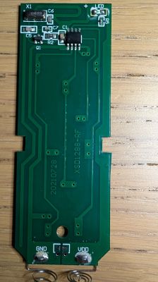 XSD1288-RF remote control PCB with microchip, components, and battery contacts.