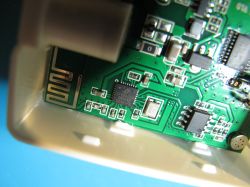 Close-up of a circuit board with a processor and electronic components.