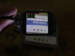 Sipeed M1s Dock Module Interface Close-up of the Sipeed M1s Dock module with a 2MP camera and 1.69-inch display, showing interface graphics.