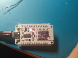 Sparkle IoT model XH-WB3S electronic board connected to a USB port on a blue surface.