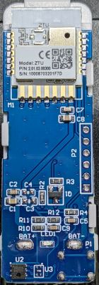 Electronic board with components and markings, including a module labeled ZTU.